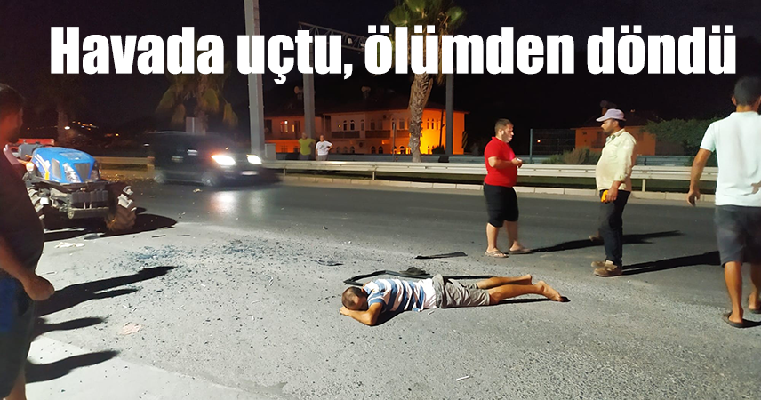 raktöre çarpan sürücü otomobilin camından yola fırladı